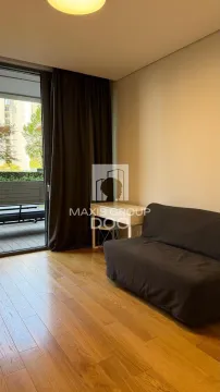 Small living room with a sofa and access to the terrace. - image 6