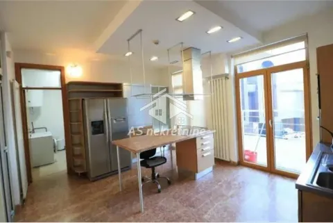 Spacious kitchen with a work island and access to the terrace. - image 6