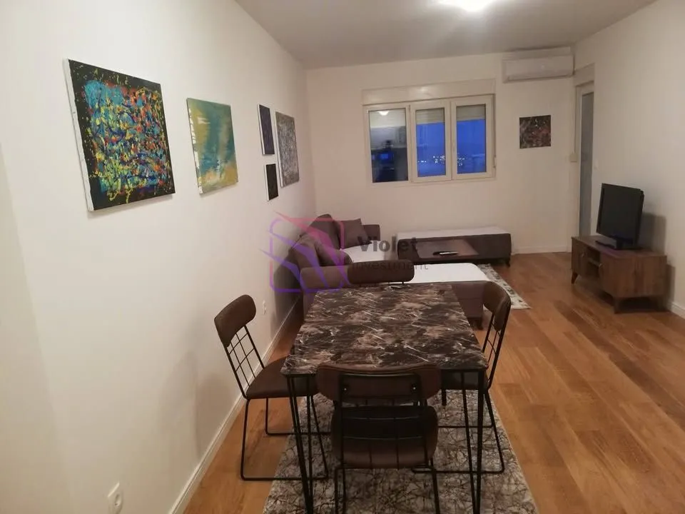 Living room with a dining table and seating set.