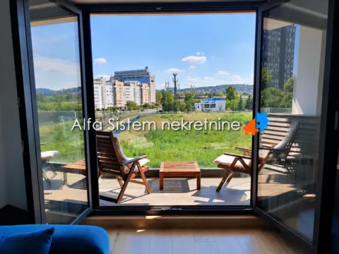 Nameštena terasa sa pogledom na grad i zelenilo. - image 5