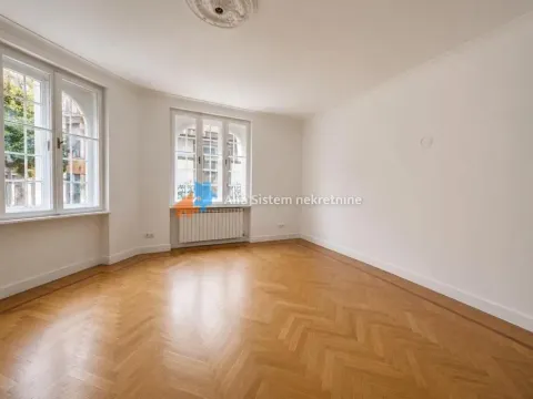 Empty room with wooden parquet flooring and windows. - image 7