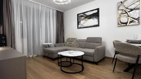 Living room furnished with a grey sectional sofa, coffee table and dining table. - image 9