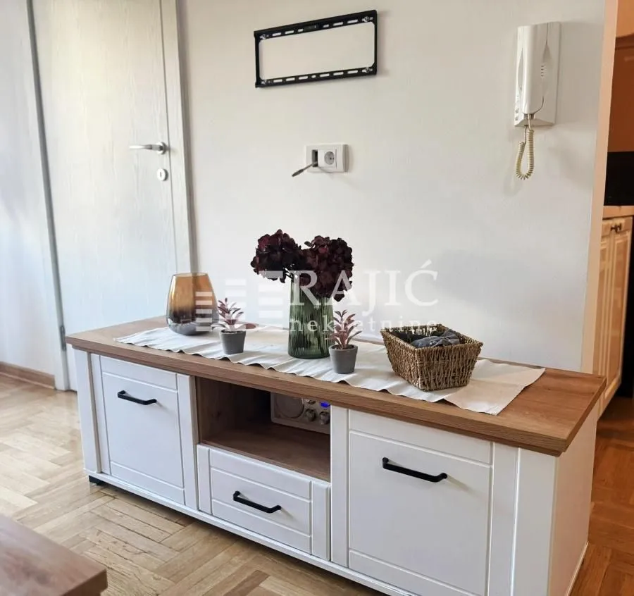TV cabinet with decoration in a bright interior.