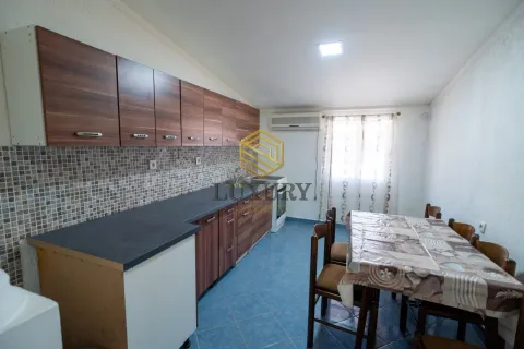 Kitchen with dining area and wooden elements. - image 4