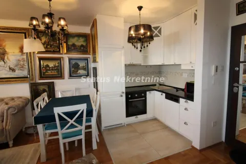 Kitchen with white cabinetry combined with the dining area. - image 6