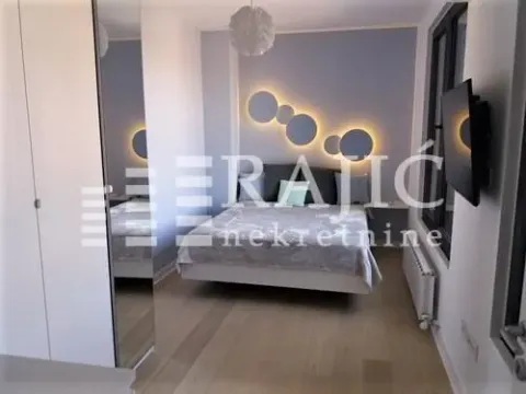 Modern bedroom with a double bed and decorative lighting. - image 8