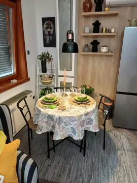 Dining table with chairs in the living room. - image 11