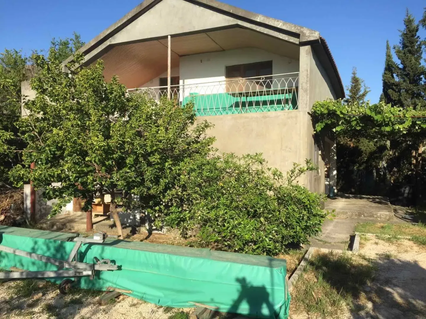 Exterior of a two-story house with a yard.