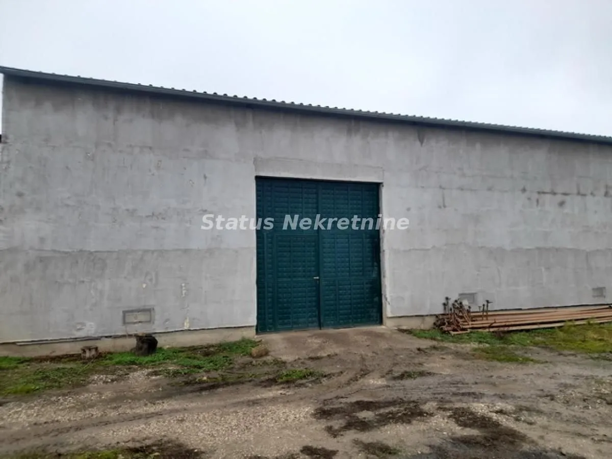 Exterior view of an industrial building with large doors.