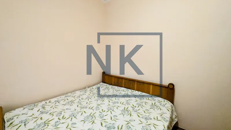 Small bedroom with a double bed.