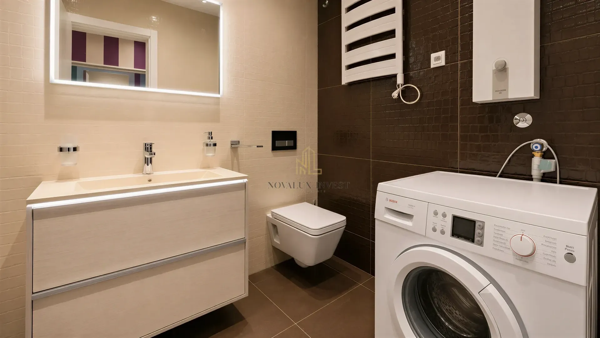 Modern bathroom with a washbasin, wall-mounted toilet, and washing machine.