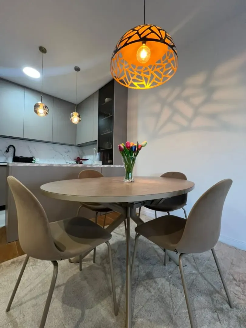 Dining table with chairs in a modern kitchen.