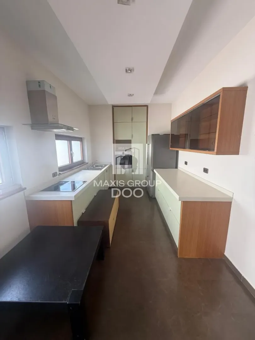 Modern kitchen with built-in cabinetry and appliances.