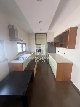 Modern kitchen with built-in cabinetry and appliances. - image 10
