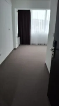 An empty room with carpet and a window. - image 2