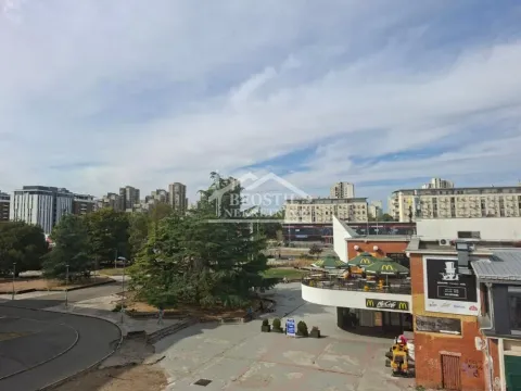 View from the window overlooking surrounding buildings and the city square. - image 20
