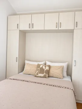 Furnished bedroom with built-in closets around the bed. - image 6