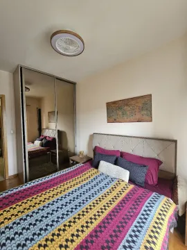 Bedroom with a double bed, mirrored wardrobe, and a map on the wall. - image 13