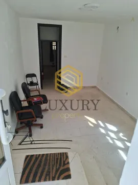 Empty room with office chairs and an agency watermark. - image 3