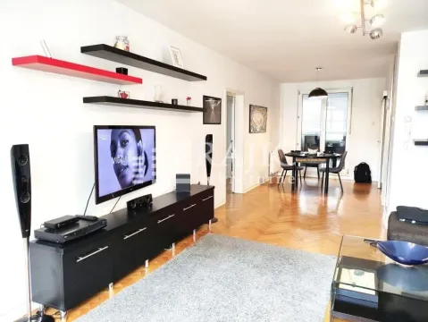 Living room with furniture, TV and dining area in the background. - image 3
