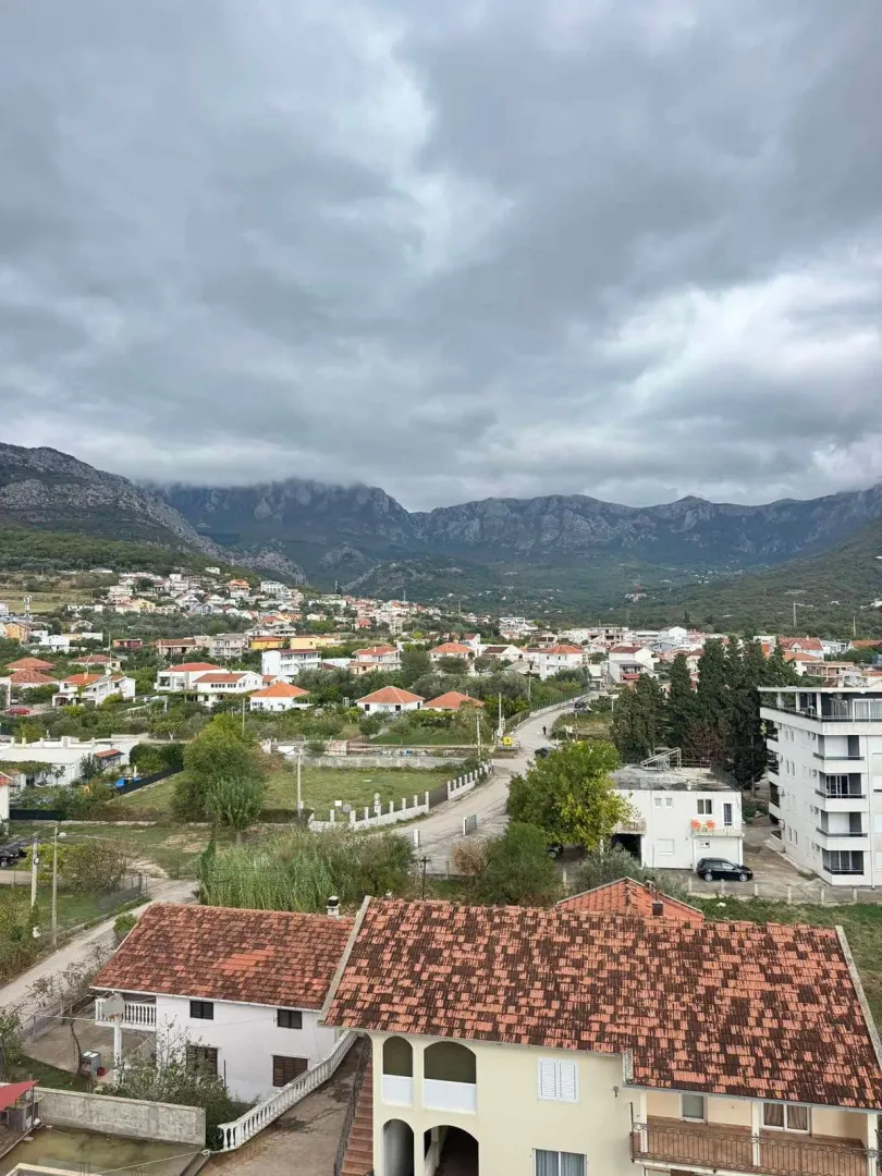 View from the terrace overlooking the settlement and surrounding mountains.