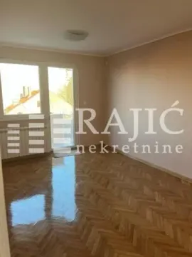 Empty room with hardwood flooring and access to the balcony. - image 3