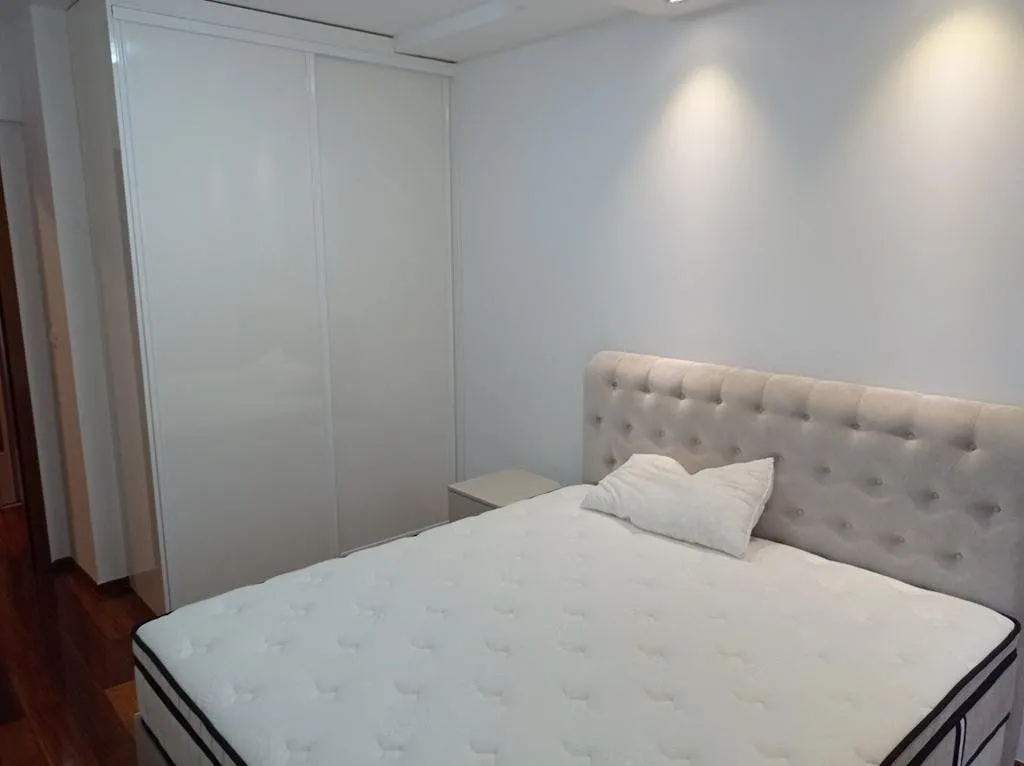 Bedroom with a double bed and a built-in wardrobe.