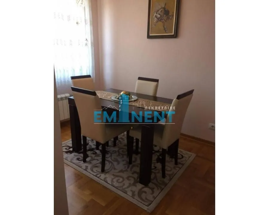 Dining area with a table and chairs.