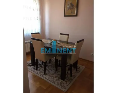 Dining area with a table and chairs. - image 5