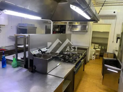 Commercial kitchen with professional equipment and appliances. - image 4