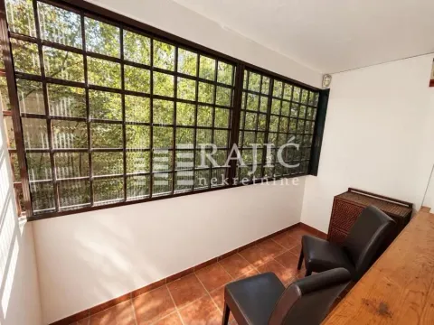 Glazed terrace with black chairs and floor tiles. - image 9
