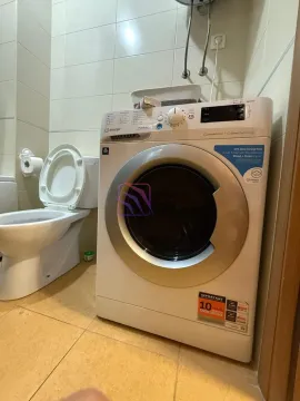 Bathroom equipped with sanitary ware and a washing machine. - image 5