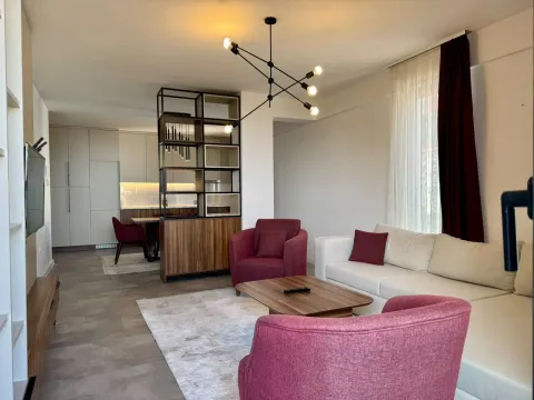 Spacious living room with a sofa set and a dining area in the background. - image 17