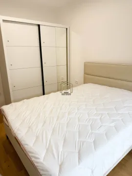 Furnished bedroom with a double bed and a fitted wardrobe. - image 2