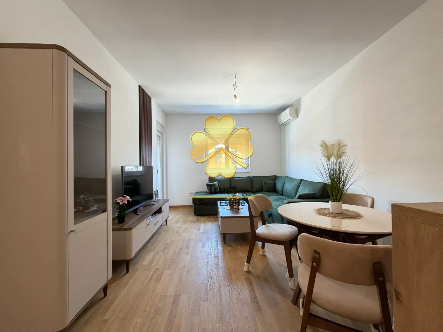 Living room with a sofa set, dining table, and furniture.