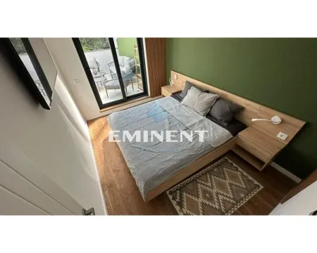Furnished bedroom with a double bed and access to the terrace. - image 7