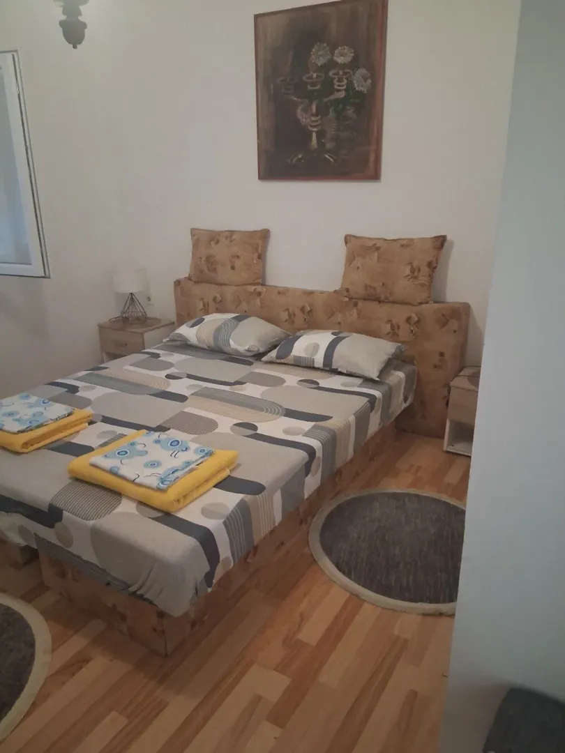 Furnished bedroom with a double bed.