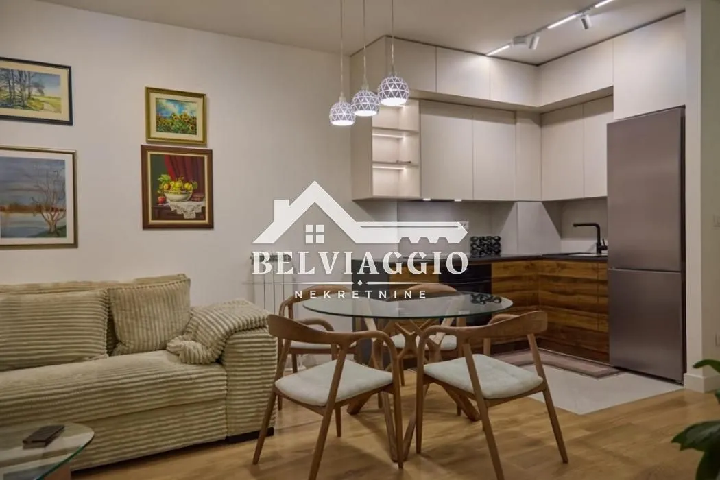 Living room with dining area and kitchen in one space.