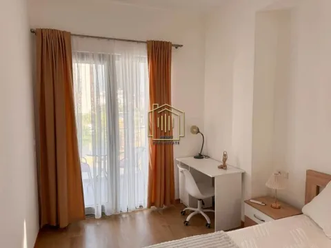 Furnished bedroom with a desk and access to the terrace. - image 11