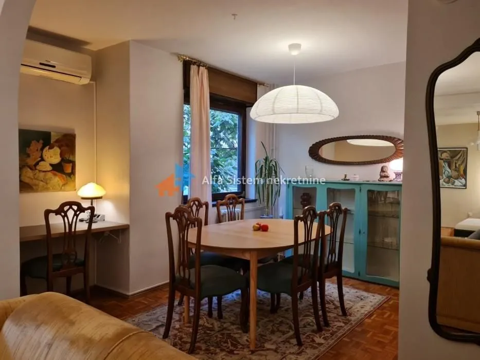Dining area connected with the living room and a working corner.