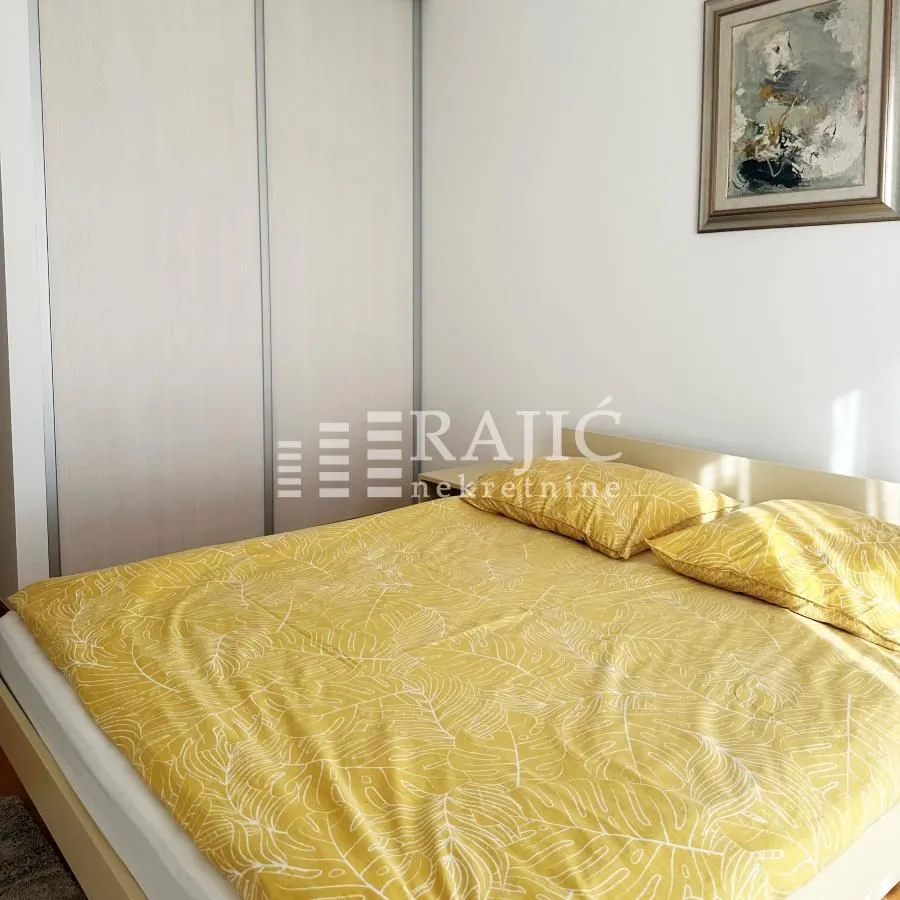 Bedroom with a double bed and a built-in wardrobe.