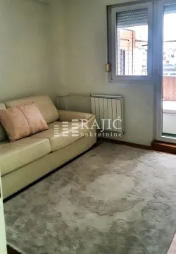 Living room with a light sofa and rug, with access to the terrace. - image 8