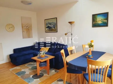 Living room with a sofa set and a dining table. - image 3
