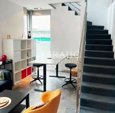 Interior of the living room with a desk and stairs. - image 5