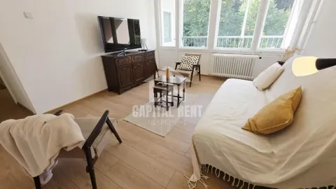 Living room with sofa, TV and a view of the enclosed terrace. - image 7