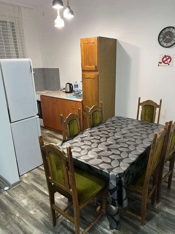 Small kitchen with a dining table and chairs.