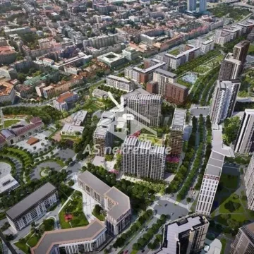 Prikaz naselja iz vazduha sa modernim zgradama i uređenim zelenim površinama. - image 8