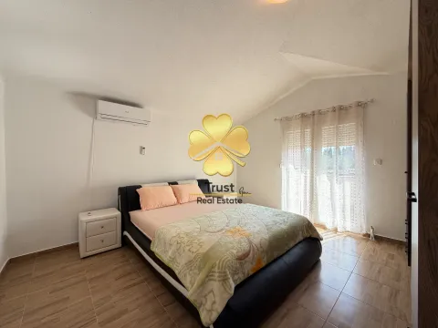 Bright bedroom with a double bed, nightstand, and terrace access. - image 13