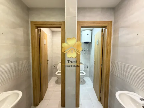 View of two bathrooms with sinks and toilets. - image 13