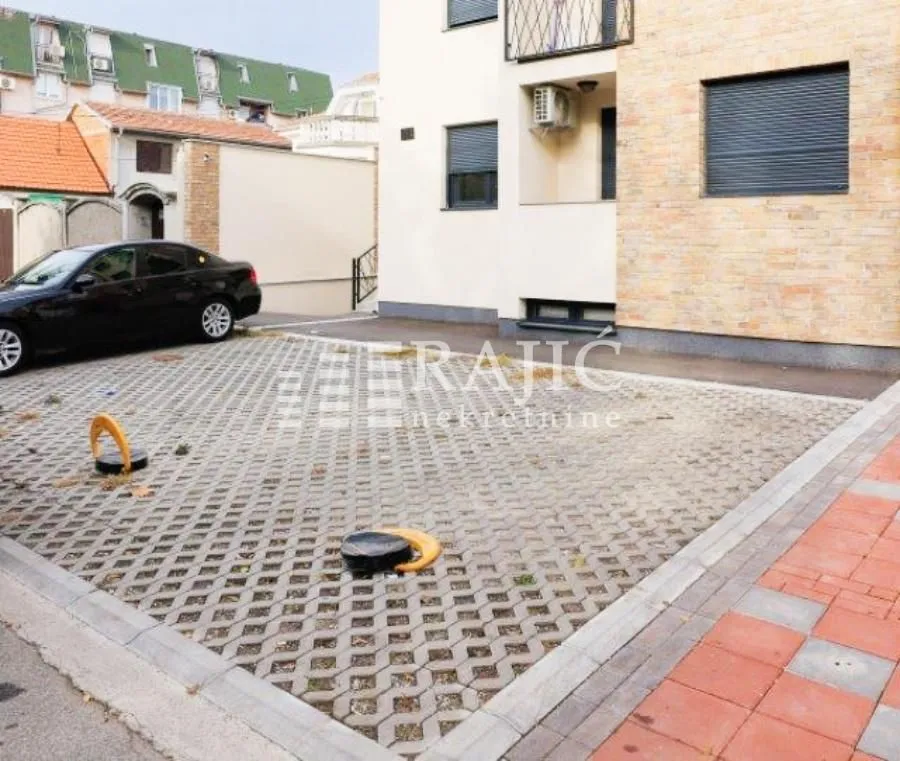 Exterior space with a parking spot in front of the building.